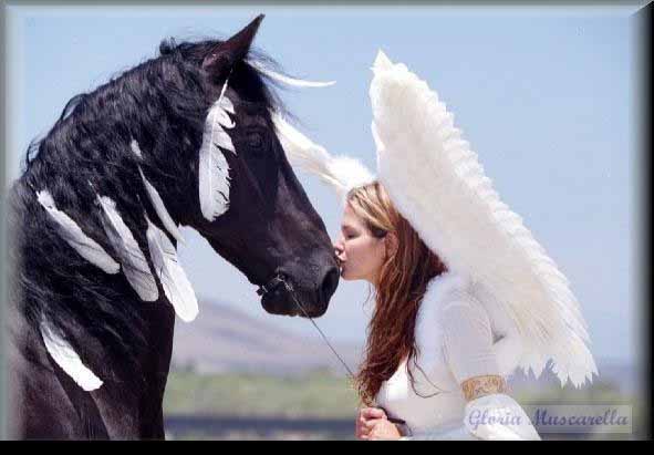 A smiling child on horseback sharing a gentle moment, nose to nose, with a therapy horse